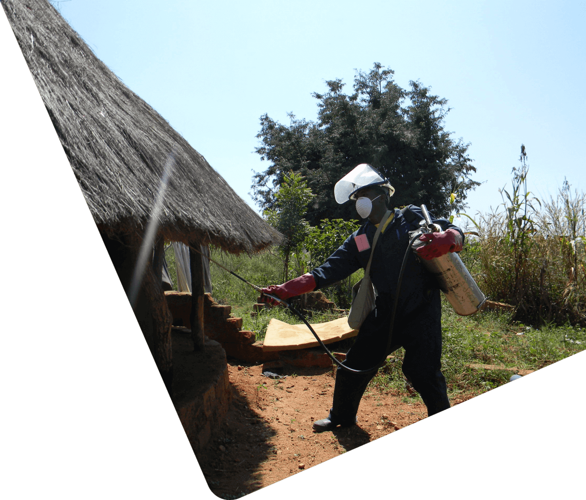 Uganda IRS sprayer outside house